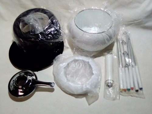 Brand New and clean. An Estate find, a German, Complete and boxed white enamel Fondue.