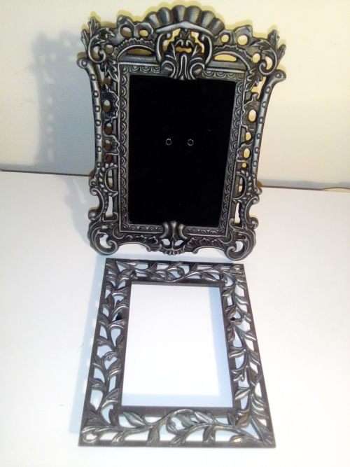 2 Beautiful metal picture frames, No Glass one Pewter is 19cm x 15cm and the other is 14cm x 12cm.