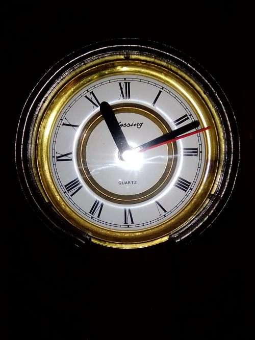 A clean dark wood working Quarts `Blessing` Wall Clock. In good condition.