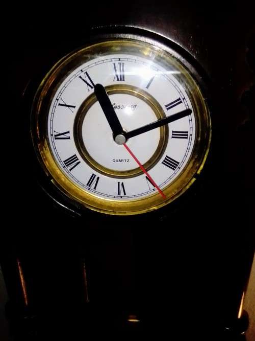 A clean dark wood working Quarts `Blessing` Wall Clock. In good condition.