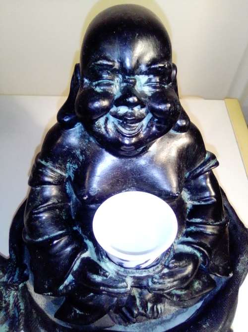 Large Green Buda with (We Think) ceramic?  bowl sitting on a money bag. In good condition.