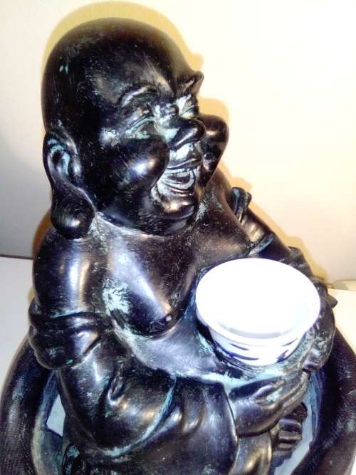 Large Green Buda with (We Think) ceramic?  bowl sitting on a money bag. In good condition.