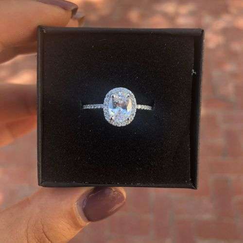 The S925 Sterling Silver 1.25 Ct. Clear Oval Cut Halo Engagement Ring