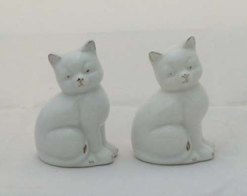 White ceramic cats with gold detail