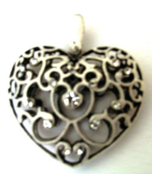 Tibetian silver heart shaped pendant with clear (crystal color) inlays