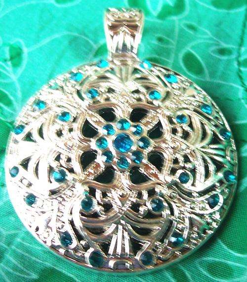 Tibetian silver round pendant with turquoise inlays