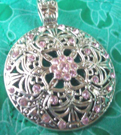 Tibetian silver round pendant with pink inlays