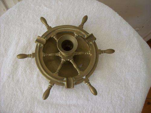 BRASS ASHTRAY AND CANDLE HOLDER.