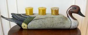 AN UNUSUAL DUCK CANDLE HOLDER