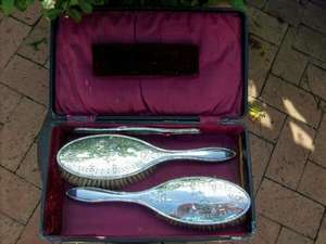 A VINTAGE SET OF HALL MARKED  SILVER  BACKED HAIR BRUSHES