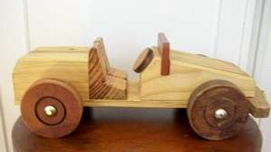 SOLID WOOD TOY CAR.