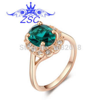 GOLD PLATED RING WITH GREEN CRYSTAL AND SILVER RHINESTONES--SIZE 9