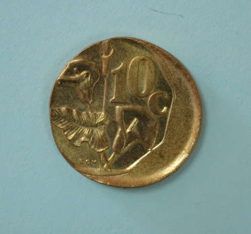 Small Yellow Ten Cent Error Coin Misstrike