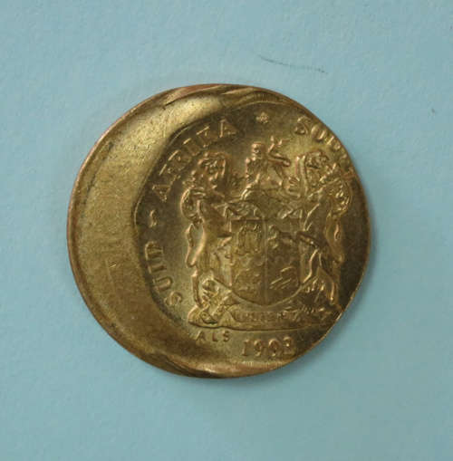 Small Yellow Ten Cent Error Coin Misstrike