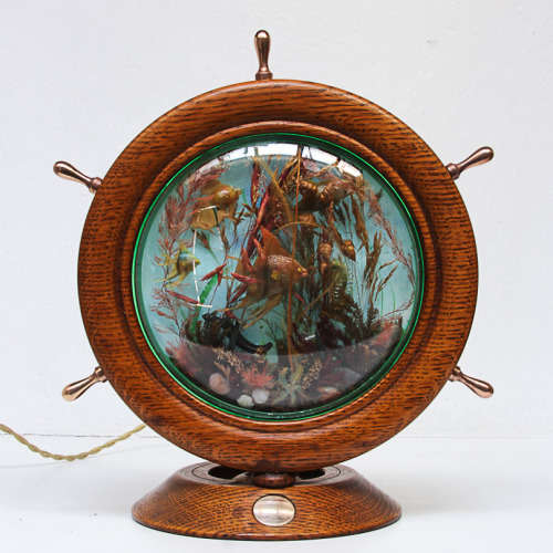 UNUSUAL LIGHT OF A SHIP WHEEL CONTAINING AN AQUARIUM - OAK, BRASS, PERSPEX - 1970's