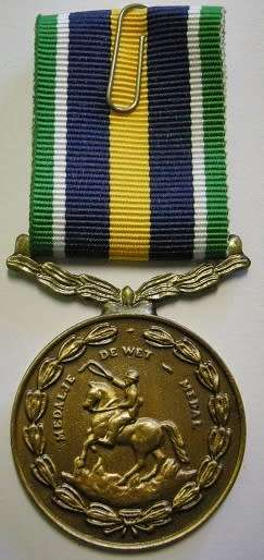 Full Size De Wet Medal Numbered at Back Uniface Suspender
