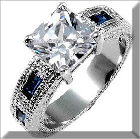 WHITE  GOLD RHODIUM PLATED WITH BLUE CZ RING SIZE 10