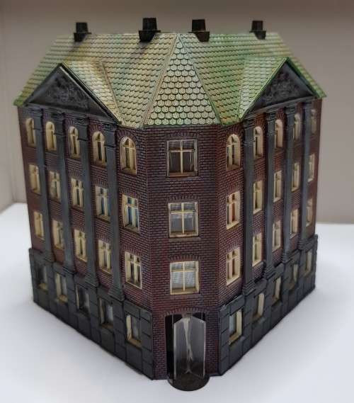 Medium high end block of flats/apartments. [Corner building]