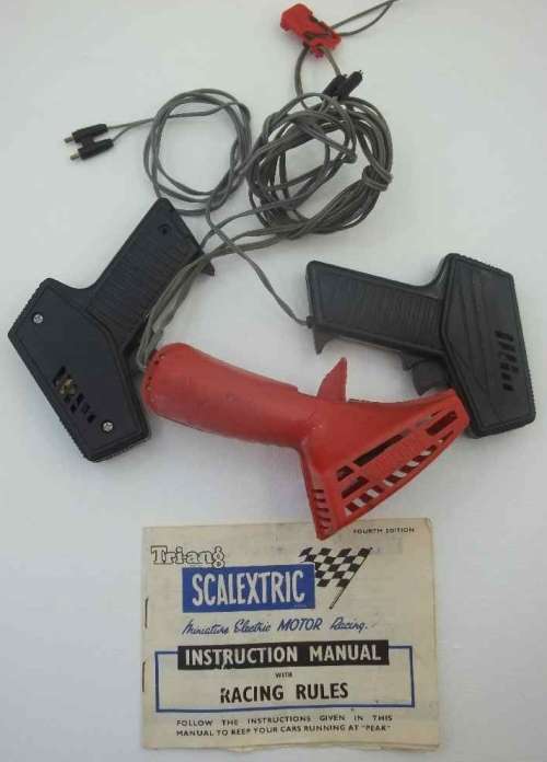 3X Controls: Red Scalextric; 2X Black Unnamed + Fourth Edition Scalextric Instruction Manual