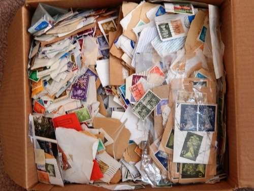 A box full of British QEII stamps on paper - 270X280X110mm - This is a heavy box!