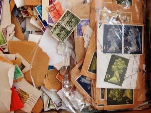 A box full of British QEII stamps on paper - 270X280X110mm - This is a heavy box!