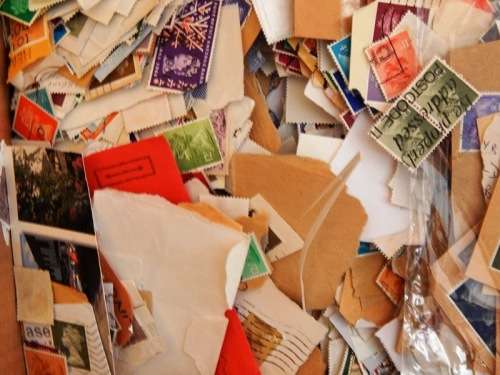 A box full of British QEII stamps on paper - 270X280X110mm - This is a heavy box!