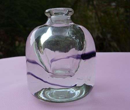 A small signed David Reade bottle , used as paperweight