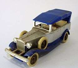 A die cast model of a vintage car by Lledo England