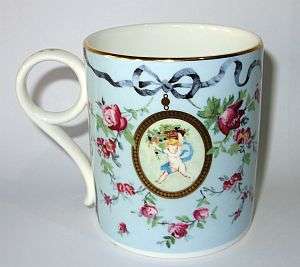 A gorgeous Wedgwood cup with bird and cherub motif - as new