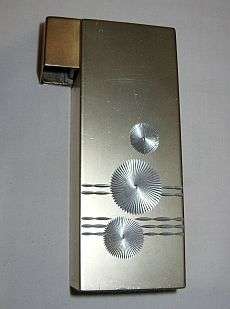 A large vintage electronic table lighter