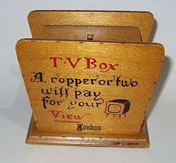 A vintage wooden money box with secret opening