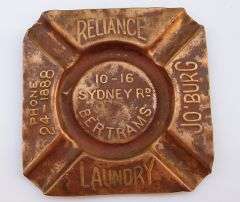 A very old copper advertising ashtray