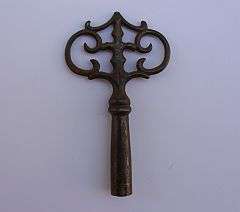An antique clock key