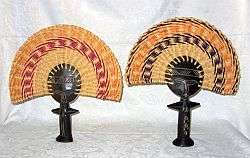 A SET OF TWO AFRICAN HAND WOVEN AND CARVED FANS - WORKS BETTER THAN CHINESE FANS