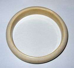 A solid ivory bangle