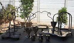 Assorted silver plate condiment holders plus salt and pepper holders and egg cups