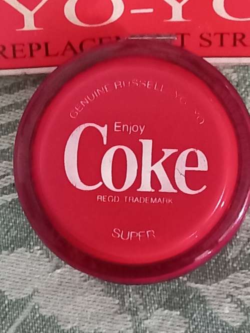 Vintage Russels yo yo coke with 3 pack of original strings.