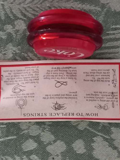 Vintage Russels yo yo coke with 3 pack of original strings.