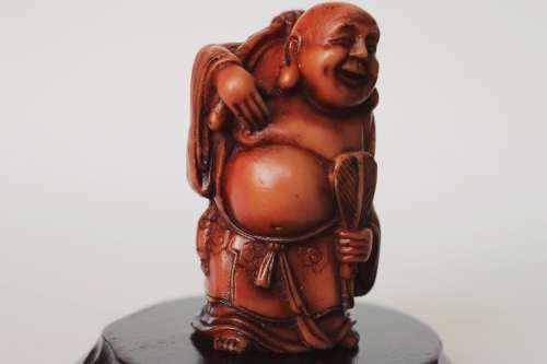 Vintage Hotei Laughing Buddha With Money Bag and Fan Resin Figurine on Wood Display Stand c1950s EUC