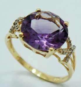 **R2 500.00**NICE 9KT YELLOW GOLD ROUND AMETHYST & DIAMOND RING