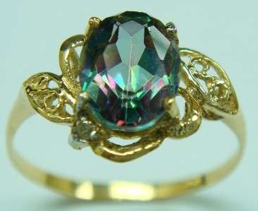 **R2 500.00**10KT YELLOW GOLD OVAL CUT MYSTIC TOPAZ & DIAMOND RING