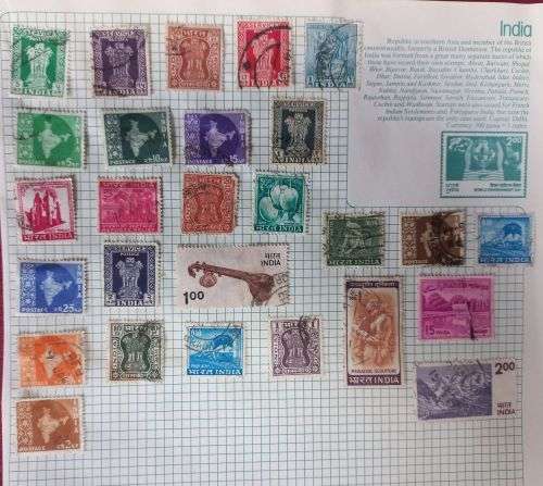 27 Indian Stamps hinged on paper