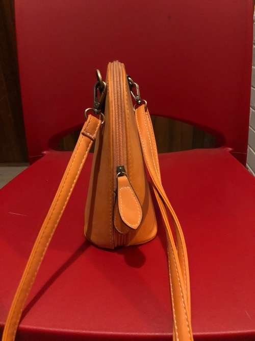 Lovely orange leather sling handbag