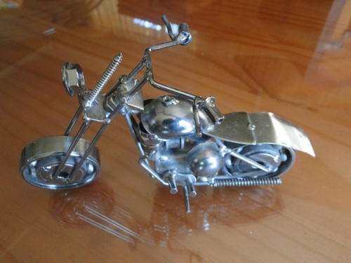 Metal motorcycle made out of bolts, nuts, scrap metal
