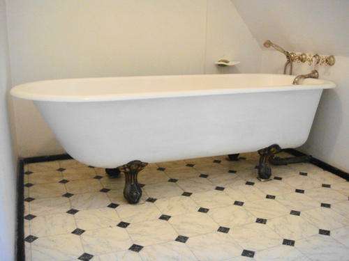 Vintage Cast Iron Bath with Brass Claw Feet