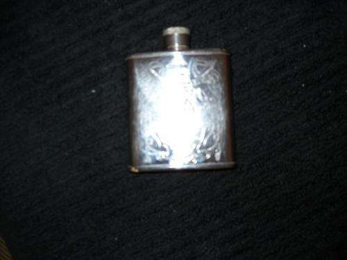Hip flask with crest