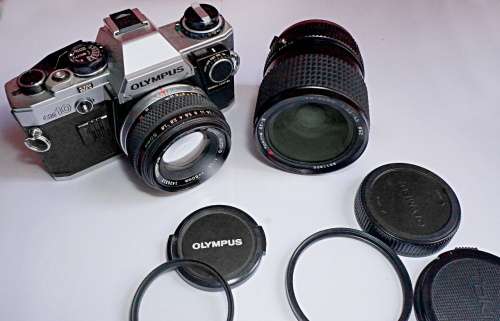 Olympus OM10 35mm SLR with lenses + PS200 Flash + UV filters etc