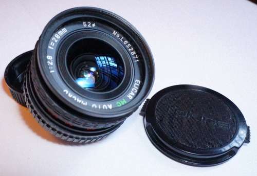 Minolta X-70 35mm SLR + Rokkor 50mm FAST f1.4 lens + 28mm f2.8 wide-angle lens + 2x converter