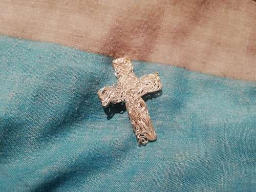 8 x dangle earrings, some with glass or gems. And one wire cross, Bulk sale together.