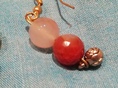 8 x dangle earrings, some with glass or gems. And one wire cross, Bulk sale together.